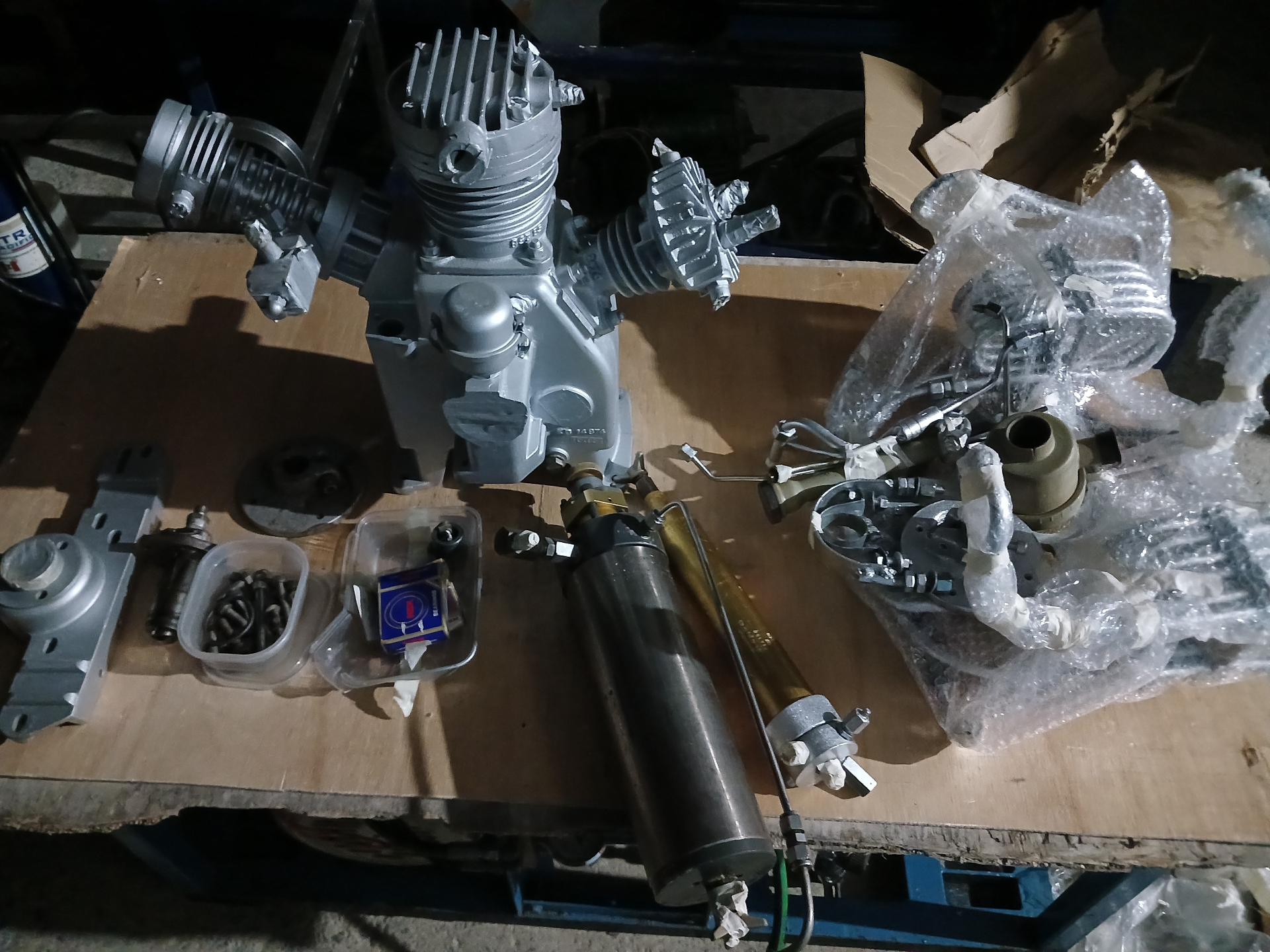 Freshly rebuilt compressor block staged on the bench