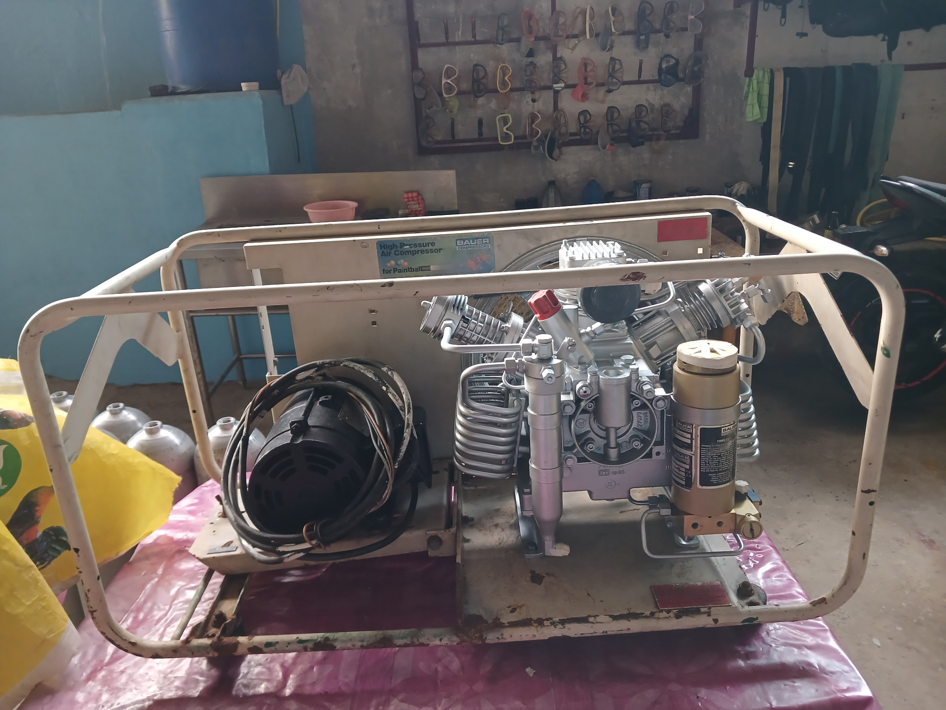 Portable Bauer compressor in white service cage