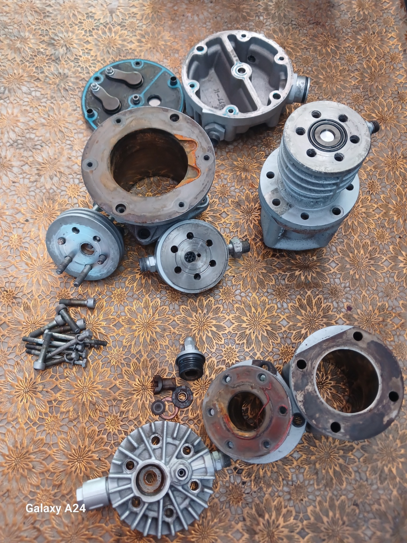 Compressor valve heads and cylinders fully disassembled for service