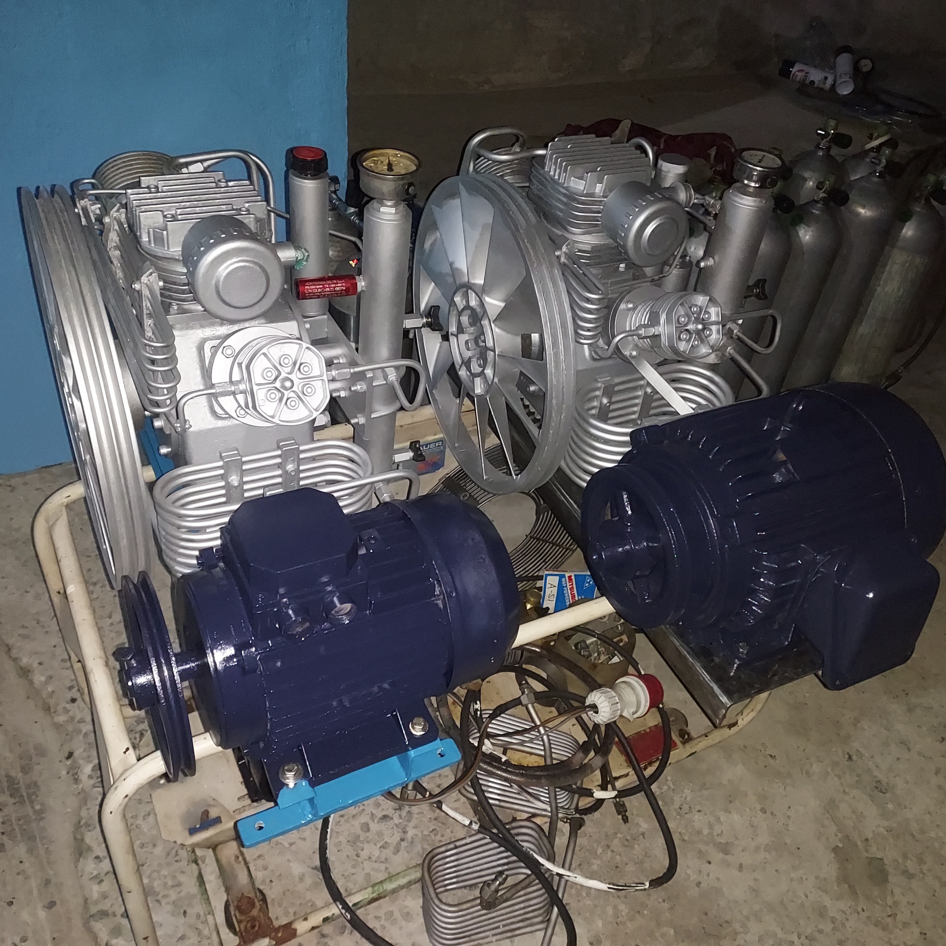 Twin Bauer compressors with freshly painted motors in the shop