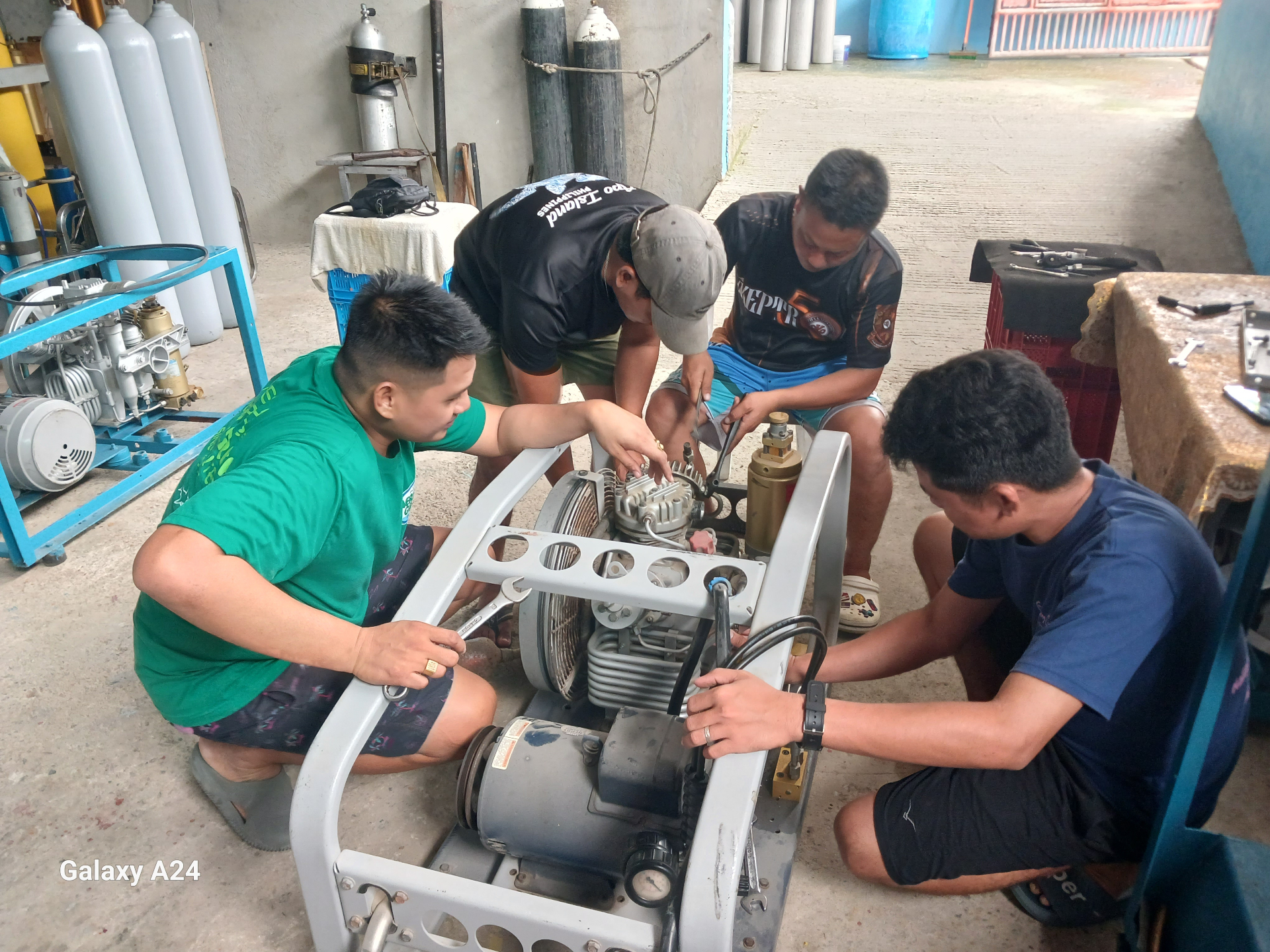 Team rebuilding a compressor frame during hands-on service work